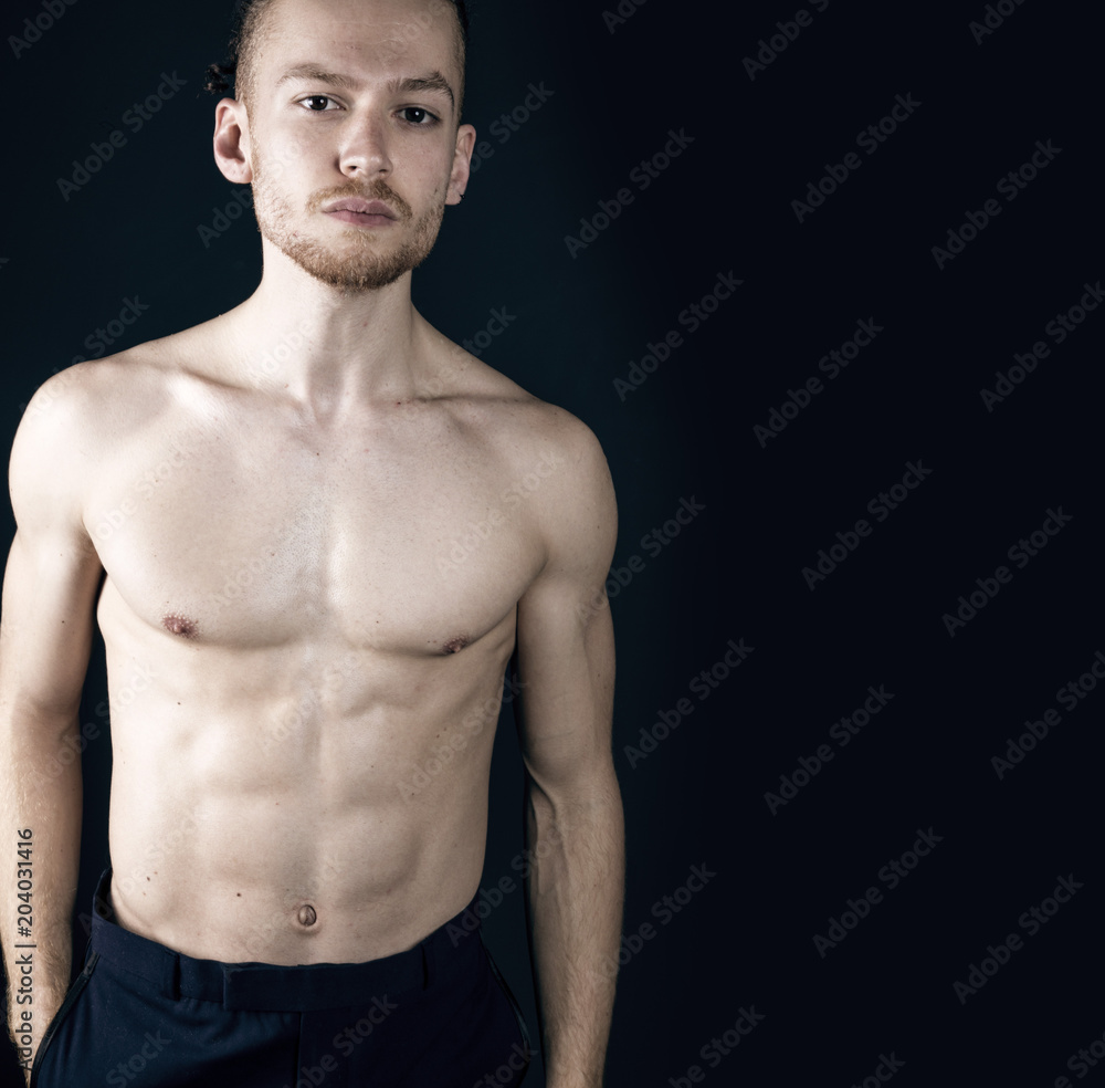 Young ginger topless man studio portrait Young ginger topless man studio portrait