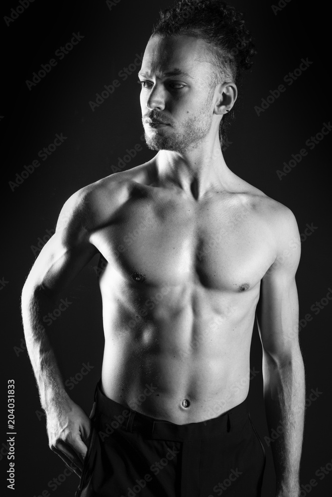 Young ginger topless man studio portrait Young ginger topless man studio portrait