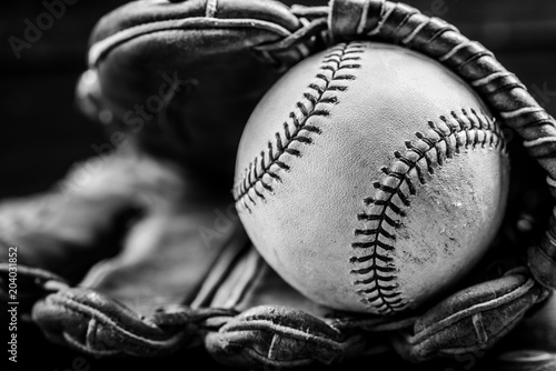 Canvas Print A group of vintage baseball equipment, bats, gloves, baseballs on wooden backgro