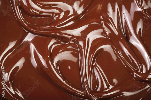 Melted chocolate swirl as a background closeup