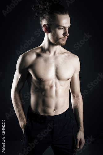 Young ginger topless man studio portrait