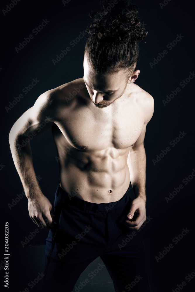 Fototapeta premium Young ginger topless man studio portrait