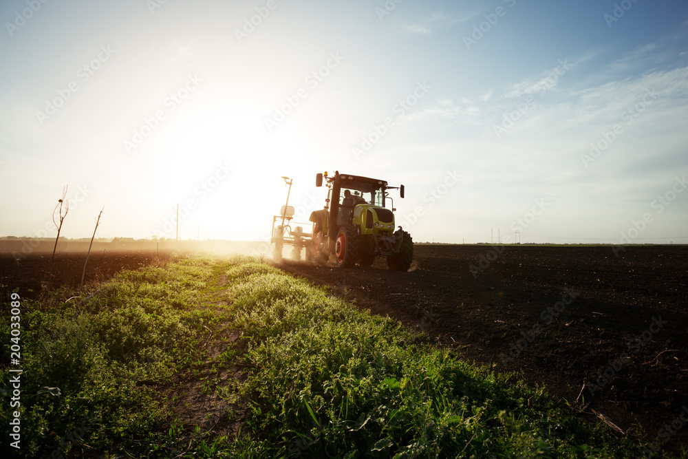 Farmer seeding crops at field