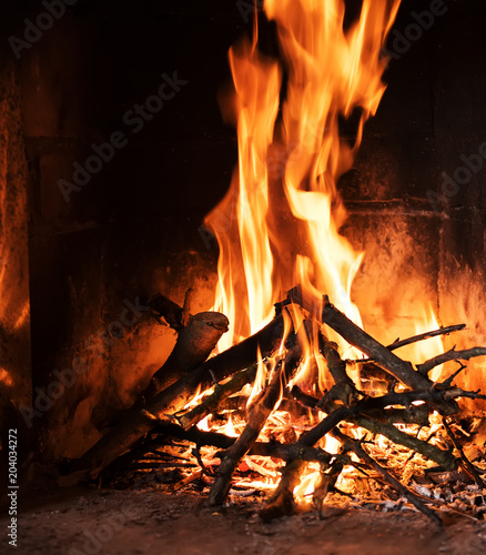 A fire burns in a fireplace