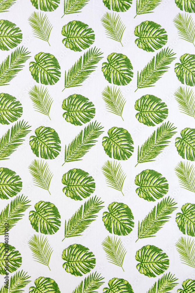 Palm leaves on white tablecloth fabric picnic texture. Textile, napkin, tablecloth. View from above, top. Traditional pattern and color, pattern background. Palm leaves on white tablecloth fabric picnic texture. Textile, napkin, tablecloth. View from above, top. Traditional pattern and color, pattern background.