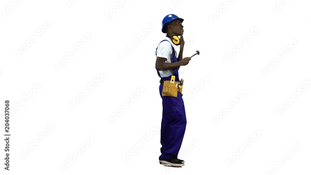 Builder of an African American finds money on the move. Alpha channel. Side view Builder of an African American finds money on the move. Alpha channel. Side view