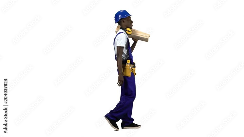 Builder african american goes to work with wooden planks in his hands. Alpha channel. Side view Builder african american goes to work with wooden planks in his hands. Alpha channel. Side view