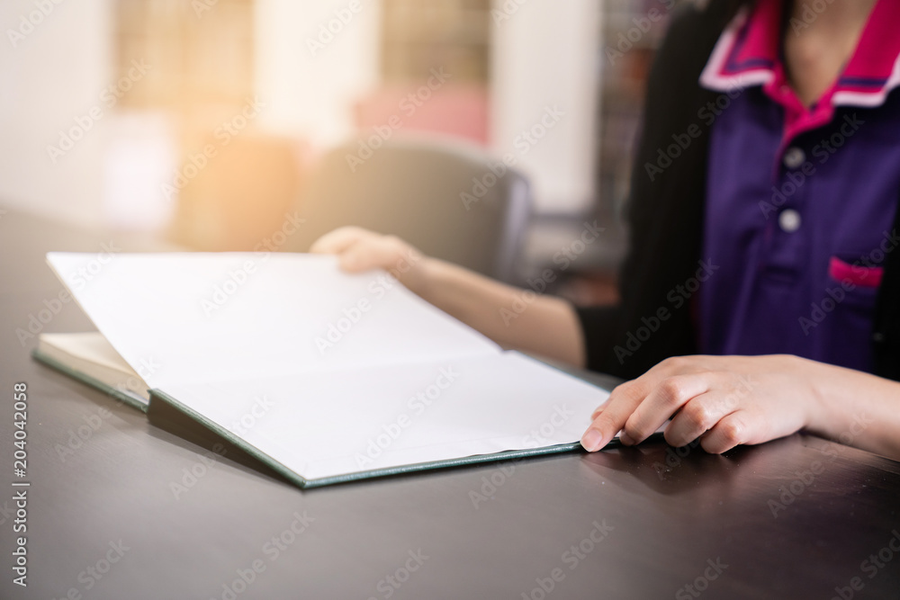 women reading book in library room, education concept. women reading book in library room, education concept.