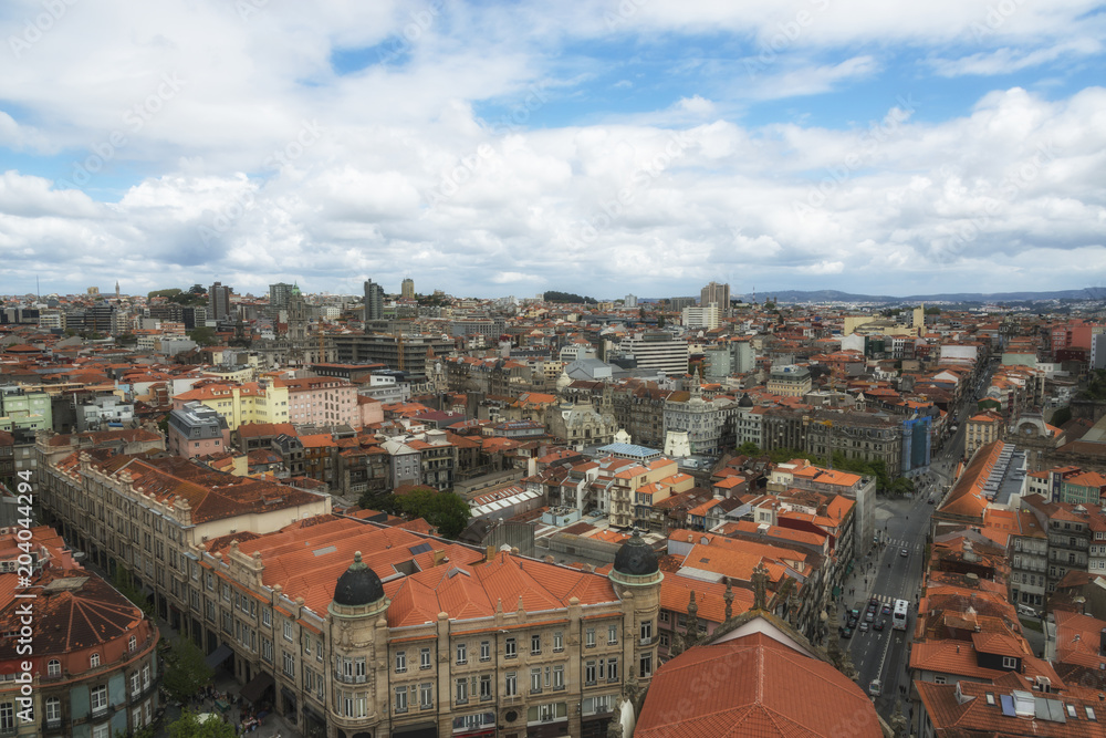 Clouds under the Porto. View from the top of Clerigos Tower. Red roofs. Porto, Portugal.
