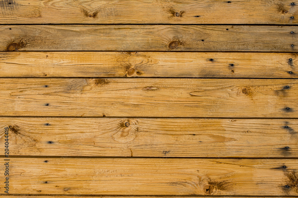 Light brown wooden planks, wall, table, ceiling or floor surface. Light brown wooden planks, wall, table, ceiling or floor surface.