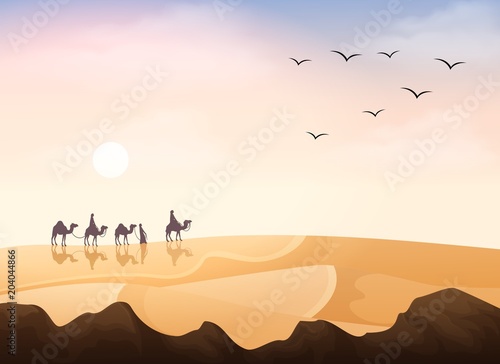 Group of Arab people riding with camels caravan in the desert