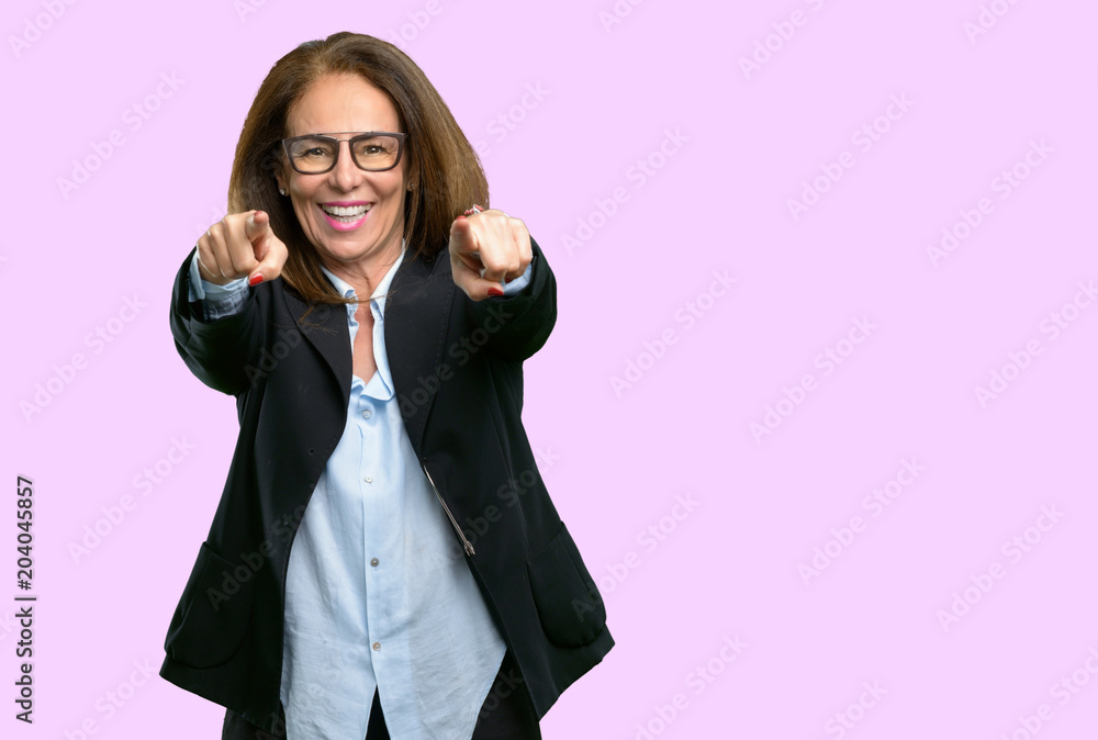 Middle age business woman pointing to the front with finger Middle age business woman pointing to the front with finger