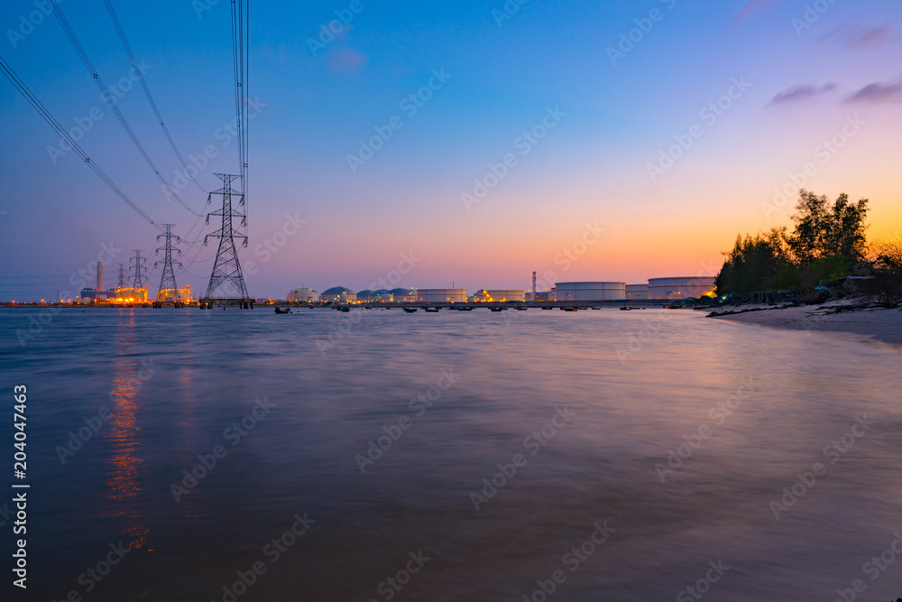 power plant light riverfront reflection at twilight- industrial landscape background