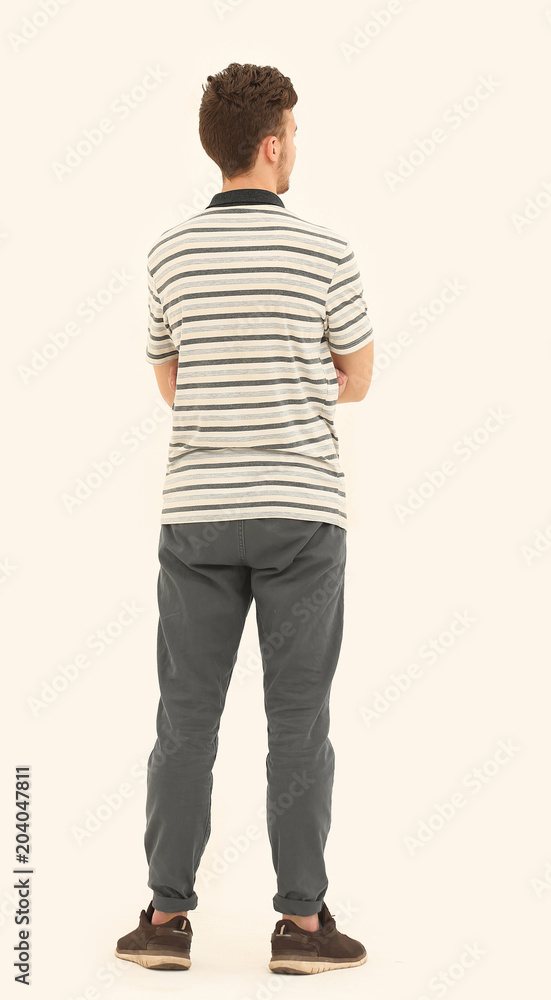 in full growth. rear view.the modern young person. in full growth. rear view.the modern young person.