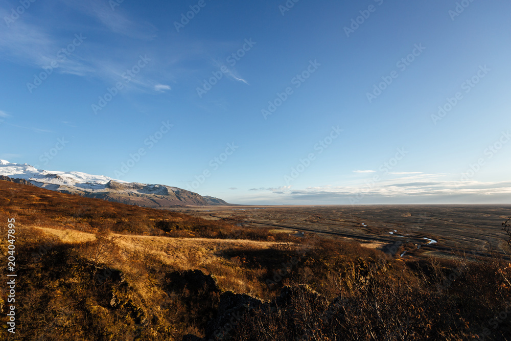 Volcanic landscape with mountains near glacier, South Iceland