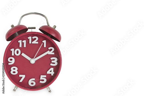 Old red alarm clock isolated on white background.Coppy space for text