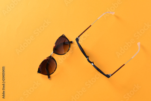 sunglasses / eyewear on pastel color paper background 