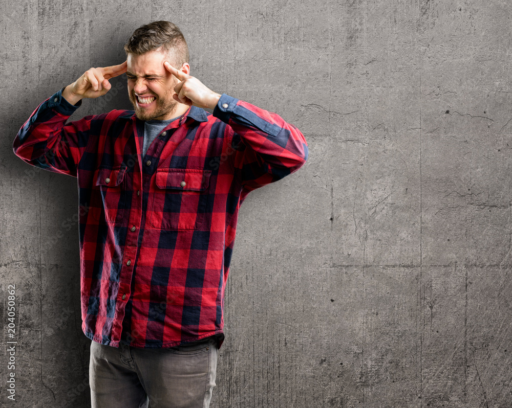 Young handsome man doubt expression, confuse and wonder concept, uncertain future