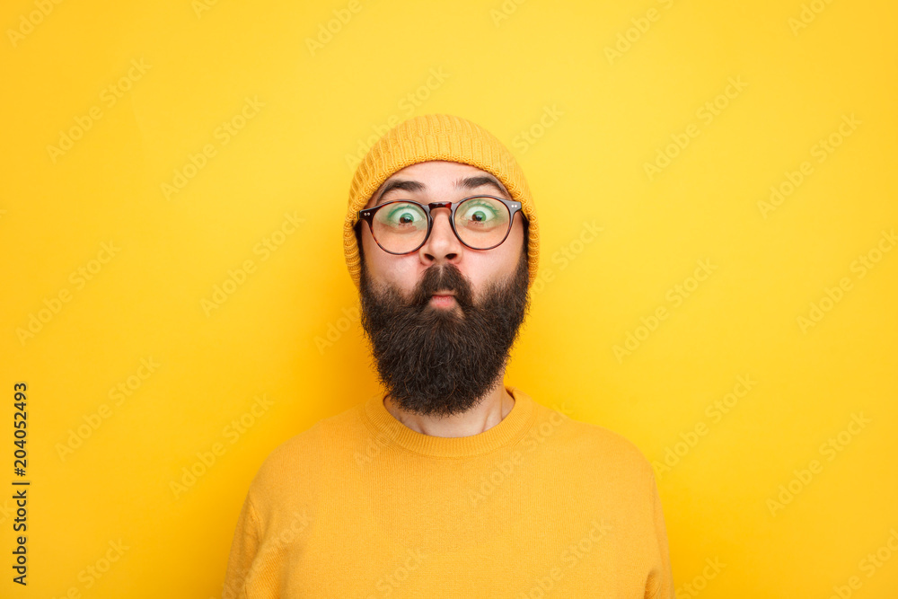 Childish hipster making faces at camera Childish hipster making faces at camera