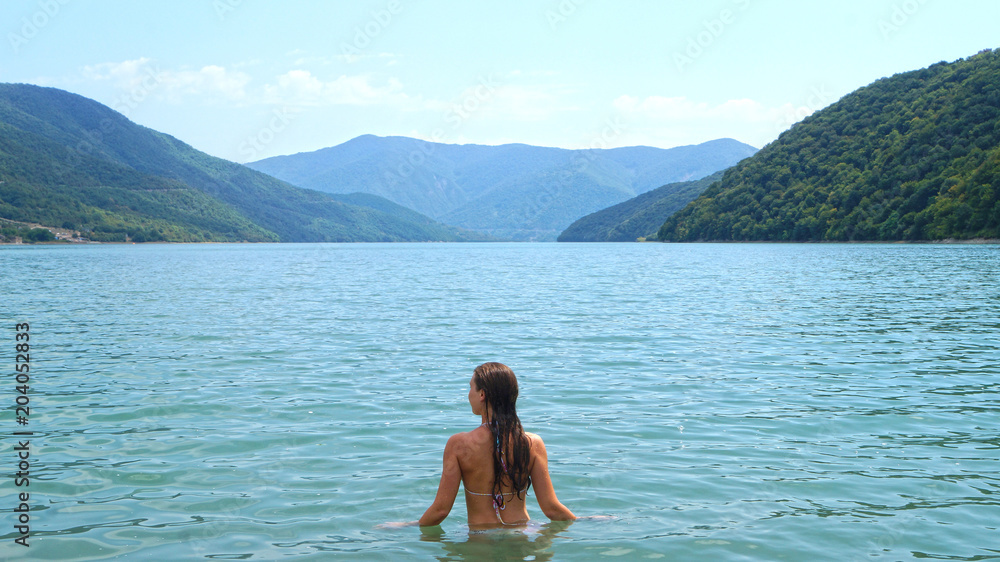 girl in mountain lake