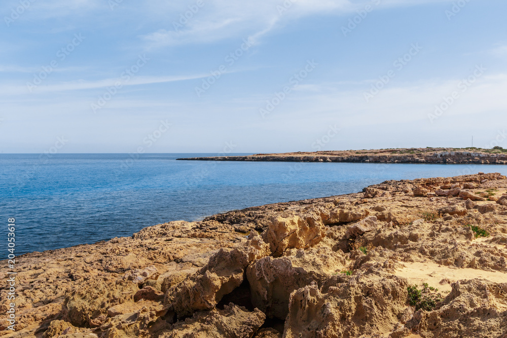 View of a rocky coast in the morning View of a rocky coast in the morning