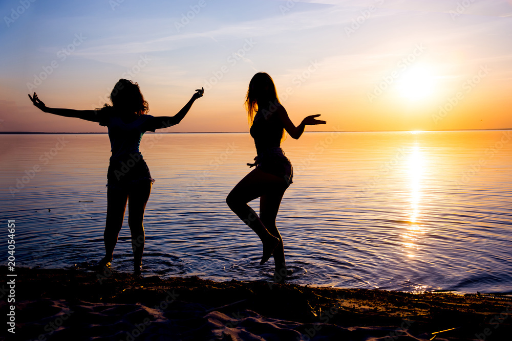 Girls At The Beach Sunset