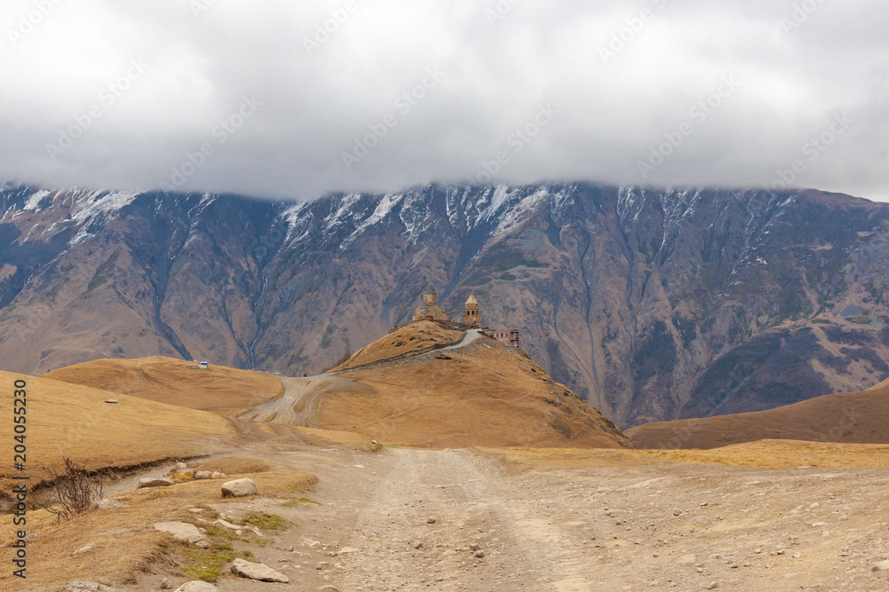 Fototapeta premium Holy Trinity Church near the village of Gergeti in Georgia