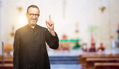 Photography Priest religion man raising finger, the number one at church