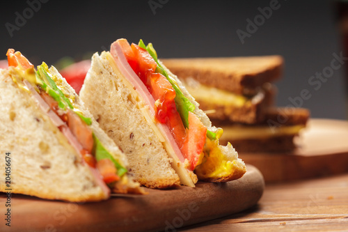 sandwich on a wooden table photo