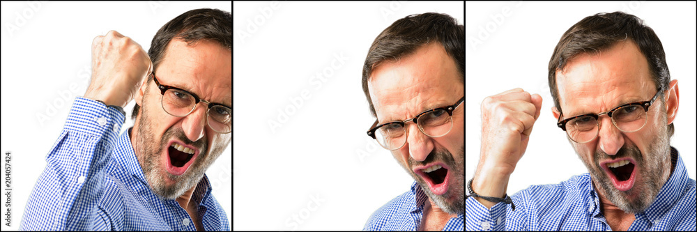 Middle age handsome man closeup happy and excited expressing winning gesture. Successful and celebrating victory, triumphant Middle age handsome man closeup happy and excited expressing winning gesture. Successful and celebrating victory, triumphant