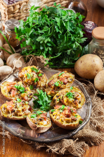 Baked potatoes stuffed with bacon, mushrooms and cheese