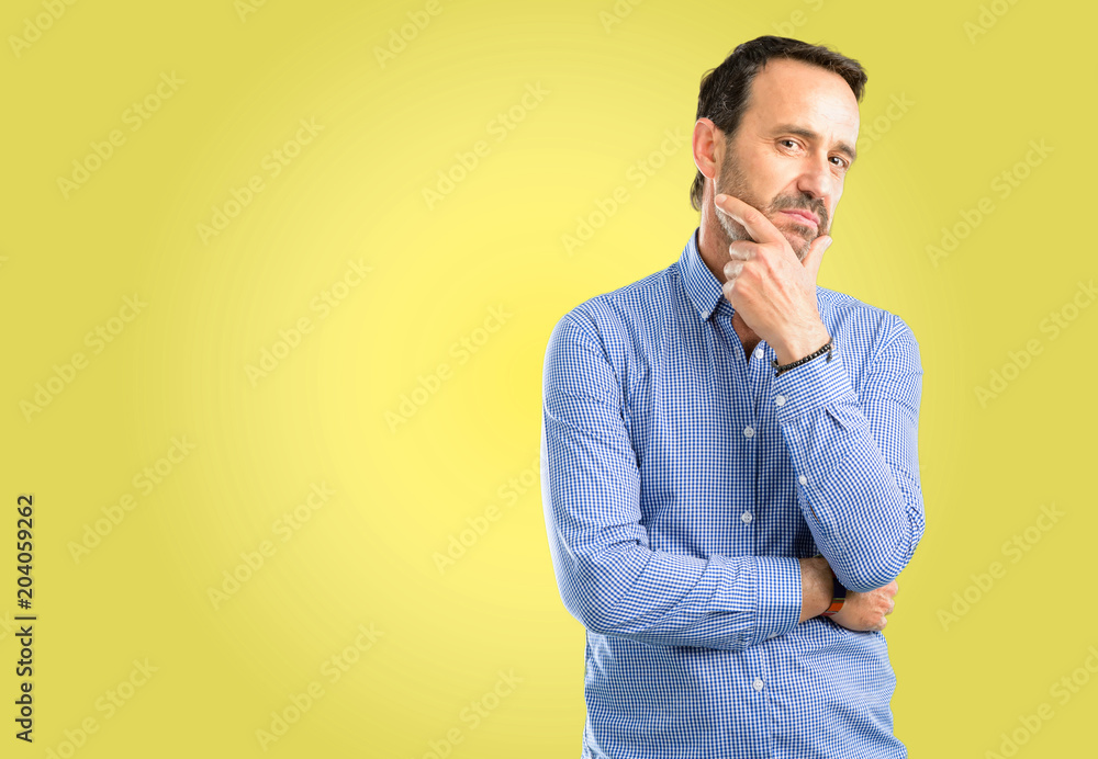 Handsome middle age man thinking thoughtful with smart face Handsome middle age man thinking thoughtful with smart face