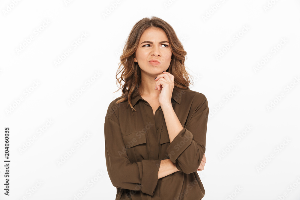 Portrait of a pensive young woman looking away Portrait of a pensive young woman looking away
