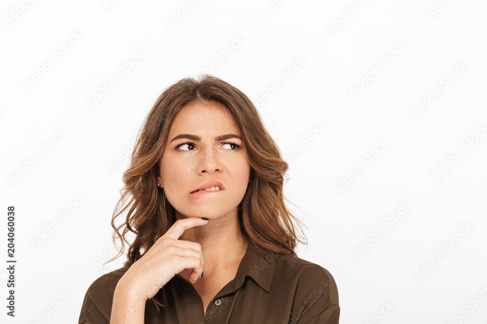 Portrait of a frustrated young woman looking away Portrait of a frustrated young woman looking away
