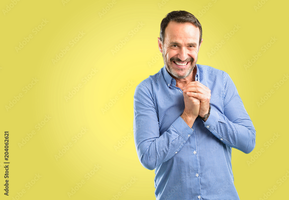Handsome middle age man confident and happy with a big natural smile Handsome middle age man confident and happy with a big natural smile