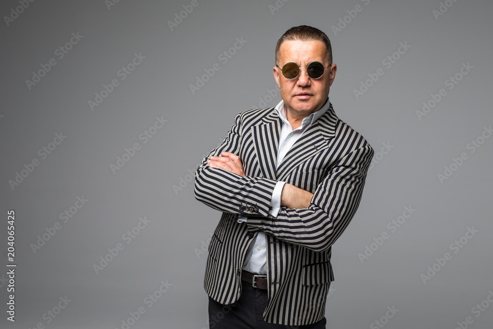 Casual moddle age man in suit Isolated over white Casual moddle age man in suit Isolated over white