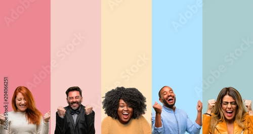 Cool group of people, woman and man happy and surprised cheering expressing wow gesture photo