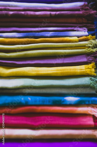 Retro look of a pile of colorful silky scarfs © Dimitri
