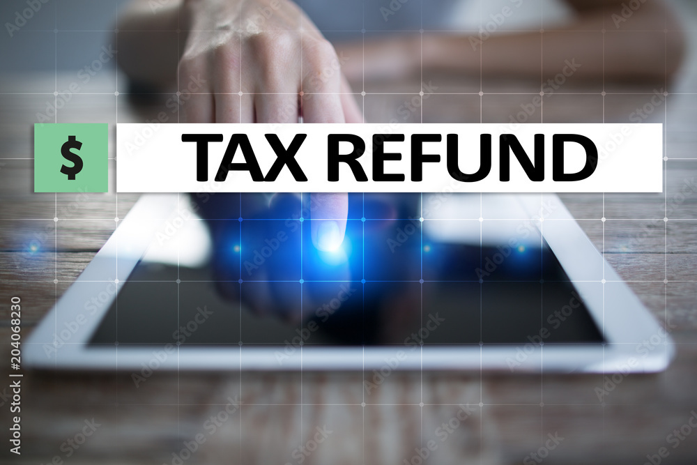 Tax refund text on virtual screen. Business and Finance concept.?