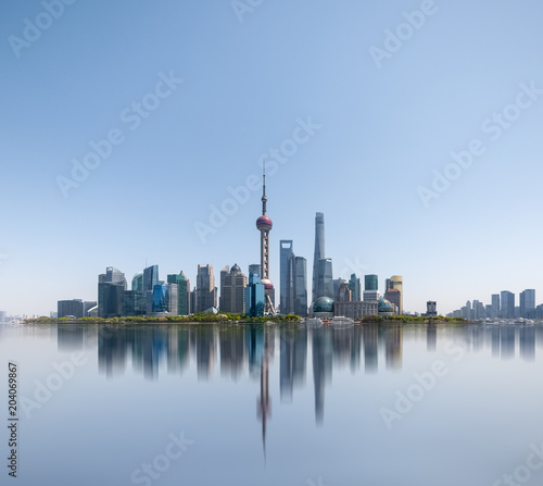 shanghai skyline reflected in huangpu river
