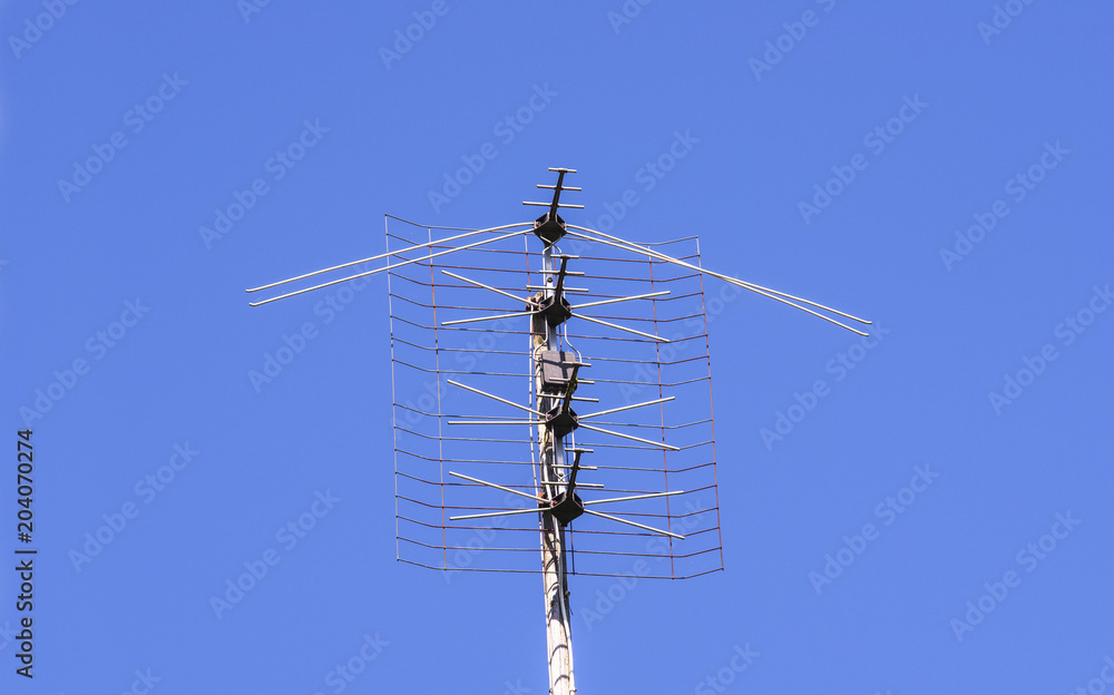 Old antenna on the sky background Old antenna on the sky background