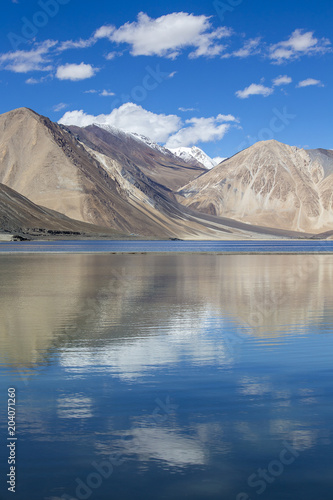 Himalayas Mountains with Pangong tso lake and blue sky with white clouds, Ladakh, Jammu and Kashmir, India