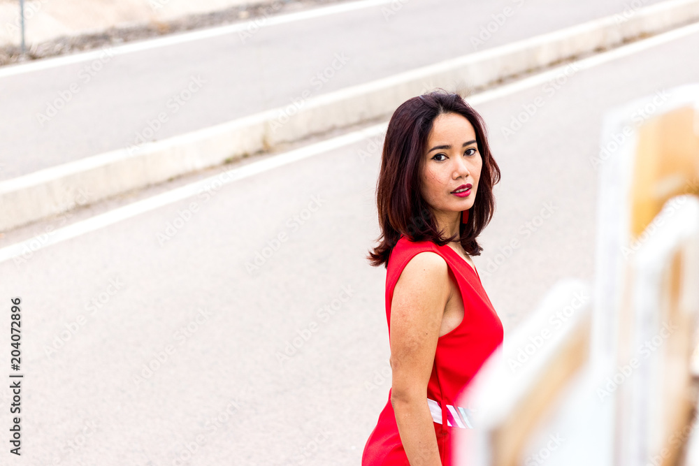 Indonesian asian woman with red long dress fashion