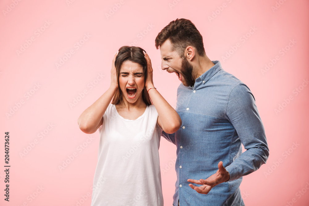 Portrait of an angry young couple having a conflict Portrait of an angry young couple having a conflict