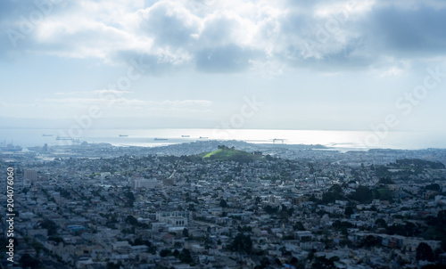 Patch of grass surrounded by city