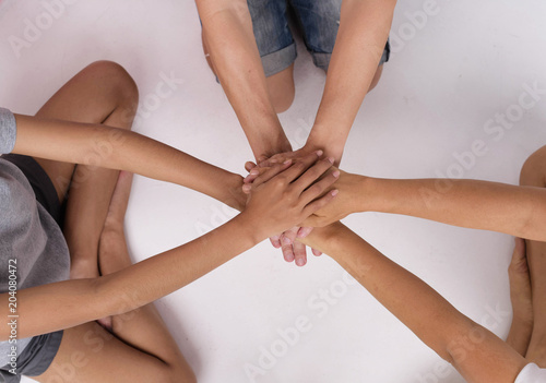 The human hands stacked together,hand sign of togetherness,partnership of human,union,the symbol of successful.the collaboration everybody.