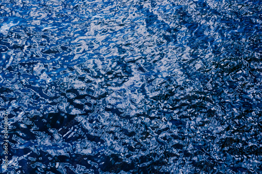 Abstract wavy liquid blue background with reflections Abstract wavy liquid blue background with reflections
