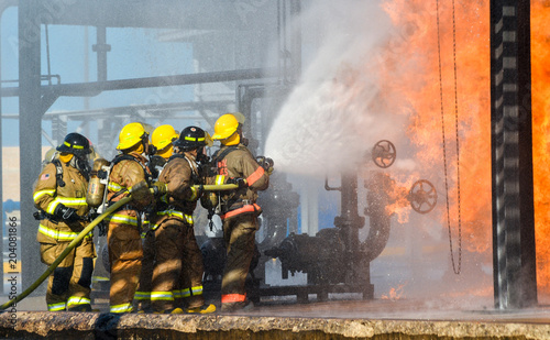 Fire fighters battling a blaze at oil pipeline refinery 