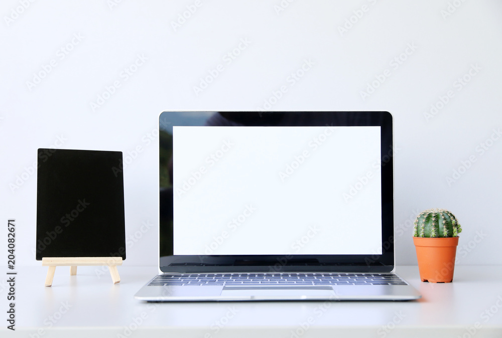 Working with Laptop computer,Hot coffee and plant copy space on desk background,business Concept Working with Laptop computer,Hot coffee and plant copy space on desk background,business Concept
