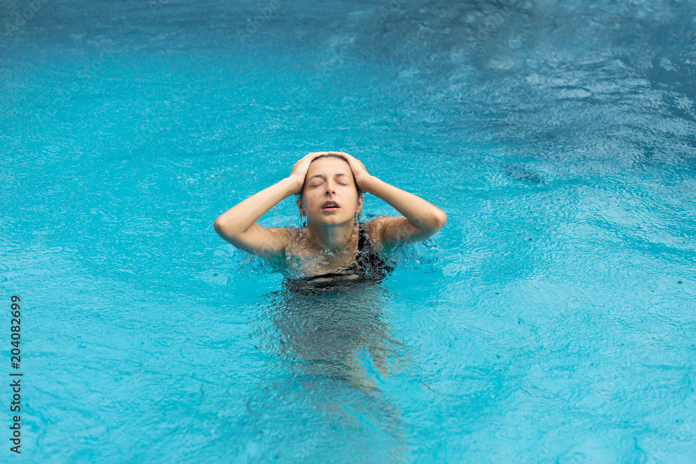 Wet woman in pool